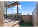 Private backyard patio with a pergola, artificial turf, and views of green space at 3734 Ridgeway St, Boulder, CO 80301
