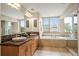 Luxurious bathroom with double vanity, soaking tub, and glass-enclosed shower for a spa-like feel at 3734 Ridgeway St, Boulder, CO 80301