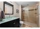 Updated bathroom with a glass-enclosed shower, modern vanity, and neutral tile at 3734 Ridgeway St, Boulder, CO 80301
