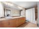 Bathroom featuring double sinks, a large mirror, and a shower-tub combination with a curtain at 3734 Ridgeway St, Boulder, CO 80301
