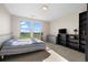 Bright bedroom with two windows, featuring a bed, dresser, and shelving units for storage at 3734 Ridgeway St, Boulder, CO 80301