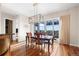 Bright dining area with modern chandelier, seamlessly connected to outdoor patio at 3734 Ridgeway St, Boulder, CO 80301