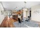 Open-concept dining room and kitchen with modern light fixtures and seating for six at 3734 Ridgeway St, Boulder, CO 80301