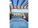 Inviting hot tub set on a private patio with scenic mountain views and a wooden pergola at 3734 Ridgeway St, Boulder, CO 80301