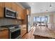 Modern kitchen features stainless steel appliances, granite counters, and wood cabinetry at 3734 Ridgeway St, Boulder, CO 80301