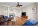 Inviting living room with a fireplace and gleaming hardwood floors, perfect for relaxation at 3734 Ridgeway St, Boulder, CO 80301