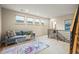 Open loft area with cozy seating, natural light from the windows, and modern decor at 3734 Ridgeway St, Boulder, CO 80301
