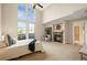Bright main bedroom featuring high ceilings, a fireplace, and access to a private balcony at 3734 Ridgeway St, Boulder, CO 80301