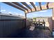Cozy patio area with a pergola, bar seating, and relaxing views, ideal for outdoor entertainment at 3734 Ridgeway St, Boulder, CO 80301
