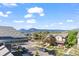 Neighborhood street view with manicured lawns, mature trees, and mountain views in the distance at 3734 Ridgeway St, Boulder, CO 80301