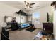 Bedroom featuring plush carpeting, a ceiling fan, natural light, and a comfortable four-poster bed at 47300 Clover Ave, Bennett, CO 80102