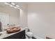 Bathroom featuring granite counter and a wood vessel sink at 2635 Spruce Meadows Dr, Broomfield, CO 80023