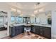 Spacious bathroom with dual vanities, modern lighting, and unique tile flooring at 2635 Spruce Meadows Dr, Broomfield, CO 80023