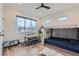 Bright bedroom with wooden floors, a table, and play tent bed at 2635 Spruce Meadows Dr, Broomfield, CO 80023