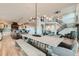 Open-concept dining area with a modern light fixture and seamless flow into the kitchen at 2635 Spruce Meadows Dr, Broomfield, CO 80023