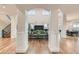 Elegant foyer featuring hardwood floors, high ceilings, and staircase with iron railings at 2635 Spruce Meadows Dr, Broomfield, CO 80023