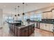 Spacious kitchen with granite countertops, stainless steel appliances, and dual islands for added functionality at 2635 Spruce Meadows Dr, Broomfield, CO 80023