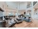 A grand living room features soaring ceilings, hardwood floors, and an open floor plan at 2635 Spruce Meadows Dr, Broomfield, CO 80023