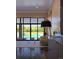 Light-filled living room features large windows overlooking the serene pool area at 2635 Spruce Meadows Dr, Broomfield, CO 80023