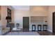 Neutral living room features an elevated bar area with dark wood floors and a modern sofa at 2635 Spruce Meadows Dr, Broomfield, CO 80023