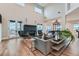 Bright living room with fireplace, wood floors, and large windows offering natural light at 2635 Spruce Meadows Dr, Broomfield, CO 80023
