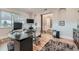 Bright home office with large window, a modern desk, and wood floors at 2635 Spruce Meadows Dr, Broomfield, CO 80023