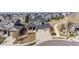 Neighborhood view featuring a well-maintained lawn, sidewalk, and cul-de-sac at 12659 Stone Creek Ct, Firestone, CO 80504