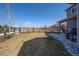 A well-maintained backyard featuring a covered patio and wooden fence provides privacy and outdoor enjoyment at 12659 Stone Creek Ct, Firestone, CO 80504