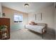 Cozy bedroom with a twin bed, bright window, and charming decor at 12659 Stone Creek Ct, Firestone, CO 80504