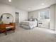 Spacious bedroom with a vanity, closet, and a large window with natural light at 12659 Stone Creek Ct, Firestone, CO 80504