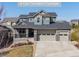 Charming two-story home with a four-car garage and covered front porch at 12659 Stone Creek Ct, Firestone, CO 80504