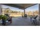 Covered patio with outdoor seating and grill, perfect for entertaining at 12659 Stone Creek Ct, Firestone, CO 80504