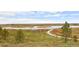 Picturesque view of meandering walking trails leading to scenic lake views, enhancing the natural beauty at 12659 Stone Creek Ct, Firestone, CO 80504