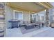Outdoor patio with grill, furniture, and covered sitting area at 26293 E Archer Ave, Aurora, CO 80018