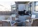 Backyard patio with outdoor seating around a fire pit at 26293 E Archer Ave, Aurora, CO 80018