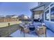 Beautiful backyard featuring a fire pit and seating area, ideal for relaxation at 26293 E Archer Ave, Aurora, CO 80018