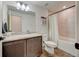 Well-lit bathroom features a vanity with granite countertop and a shower-tub combination at 26293 E Archer Ave, Aurora, CO 80018