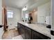 This bathroom features a large vanity, great lighting, and a shower/tub combination at 26293 E Archer Ave, Aurora, CO 80018