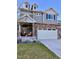 Charming two-story home features stone accents, a two-car garage, and well-maintained landscaping, offering great curb appeal at 26293 E Archer Ave, Aurora, CO 80018