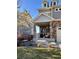 Charming covered front porch features stone pillars, adding curb appeal to the home at 26293 E Archer Ave, Aurora, CO 80018