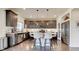 Modern kitchen with a large island, stainless steel appliances, and ample cabinet space at 26293 E Archer Ave, Aurora, CO 80018