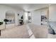 Spacious living area with large windows and built-in shelves and cabinets at 26293 E Archer Ave, Aurora, CO 80018