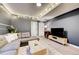 Relaxing living room with a comfortable couch, decorative lighting, and modern decor at 26293 E Archer Ave, Aurora, CO 80018