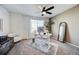 Bright office with a large window, modern desk, stylish chair and wooden dresser at 26293 E Archer Ave, Aurora, CO 80018
