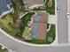This aerial view showcases a home with solar panels and a landscaped yard at 5454 S Everett Ct, Littleton, CO 80123