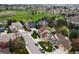 A neighborhood with manicured lawns, mature trees, and diverse architectural styles at 5454 S Everett Ct, Littleton, CO 80123