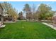Enjoy a spacious, well-maintained backyard with lush grass and a charming wooden fence at 5454 S Everett Ct, Littleton, CO 80123