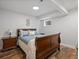 Bedroom with wooden bed frame, side tables, and a cozy atmosphere at 5454 S Everett Ct, Littleton, CO 80123