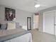 Comfortable bedroom featuring carpet floors, ceiling fan, and ample closet space at 5454 S Everett Ct, Littleton, CO 80123