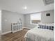 This comfortable bedroom offers a serene retreat with neutral colors and ample natural light at 5454 S Everett Ct, Littleton, CO 80123